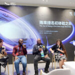 Four figures in chairs with mics in front of a wall painted with space scene and Chengdu World Science Fiction Convention: Meet the Future